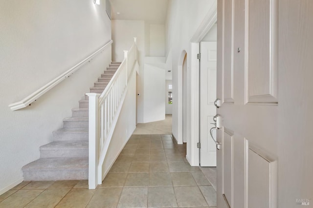 8046 Mason Dr, Rohnert Park, CA 94928 - foyer with stairs, light tile patterned floors, and arched walkways