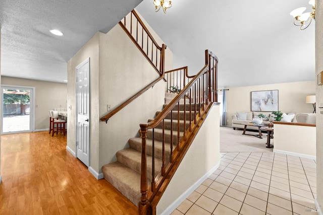 431 Inverness Way, Vacaville, CA 95687 - staircase with a chandelier, baseboards, and a textured ceiling