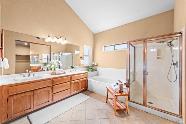 431 Inverness Way, Vacaville, CA 95687 - bathroom with double vanity, a shower stall, vaulted ceiling, a bath, and tile patterned flooring