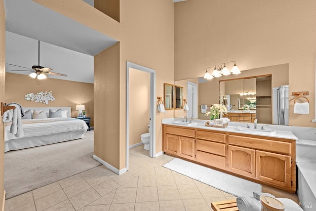 431 Inverness Way, Vacaville, CA 95687 - ensuite bathroom featuring a towering ceiling, a ceiling fan, double vanity, tile patterned floors, and toilet