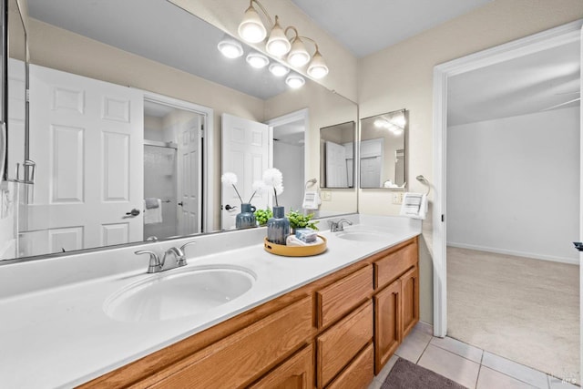 431 Inverness Way, Vacaville, CA 95687 - bathroom featuring double vanity, tile patterned floors, a shower with shower door, and baseboards