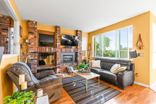 15 Marina Ridge Ct, Vallejo, CA 94591 - living room with a brick fireplace, wood finished floors, and baseboards