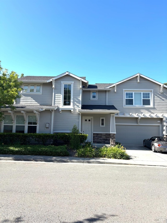 5 Sequoia Rd, San Rafael, CA 94903 - view of front facade with concrete driveway, a garage, and stone siding