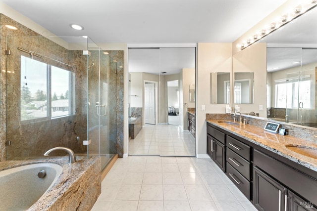 473 Mccall Dr, Benicia, CA 94510 - full bath with double vanity, a garden tub, a stall shower, and tile patterned flooring