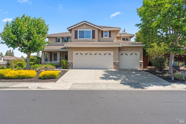 473 Mccall Dr, Benicia, CA 94510 - view of front facade featuring stucco siding, stone siding, a garage, and concrete driveway