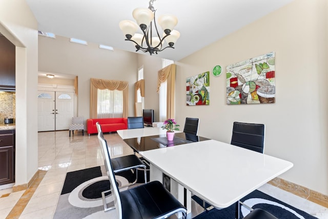 473 Mccall Dr, Benicia, CA 94510 - dining space with a chandelier, baseboards, inlaid floor details, and light tile patterned floors