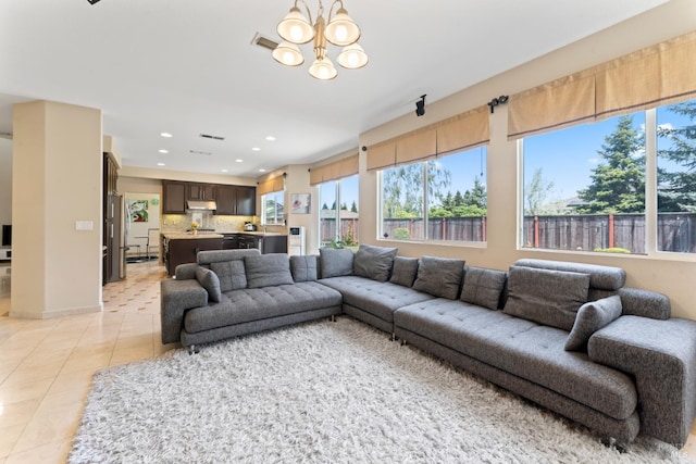 473 Mccall Dr, Benicia, CA 94510 - living room with plenty of natural light, light tile patterned floors, a chandelier, and recessed lighting