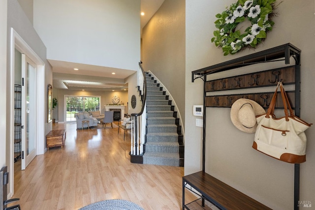 1238 Darling St, Napa, CA 94558 - foyer with a fireplace, wood finished floors, stairway, a towering ceiling, and recessed lighting