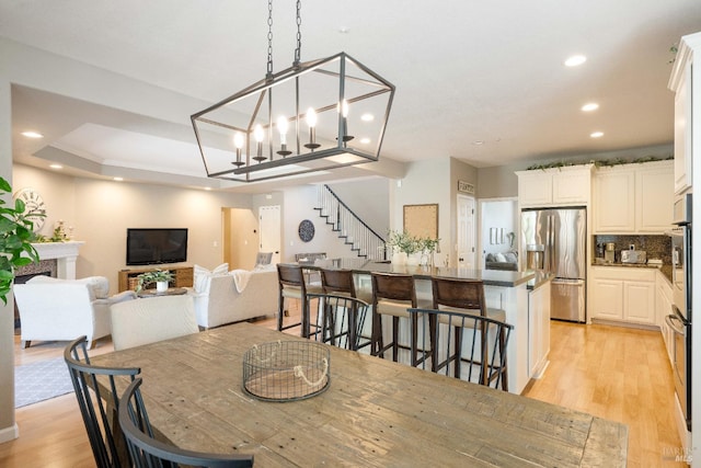 1238 Darling St, Napa, CA 94558 - dining room with recessed lighting, light wood-type flooring, and stairway