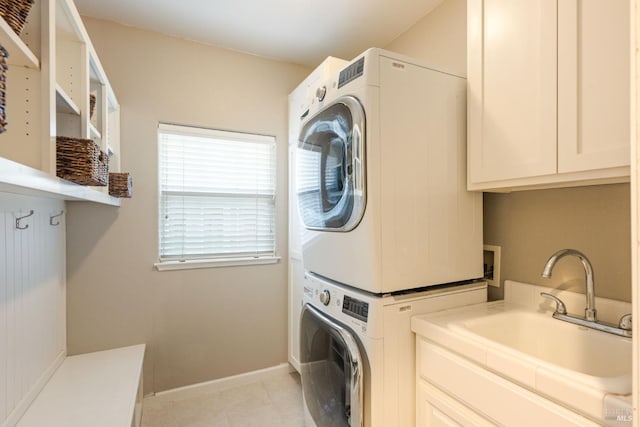 1238 Darling St, Napa, CA 94558 - washroom with estacked washer and dryer, cabinet space, and light tile patterned flooring