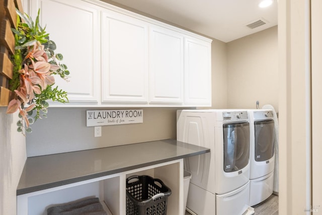 1238 Darling St, Napa, CA 94558 - laundry area featuring separate washer and dryer, cabinet space, and light wood-type flooring