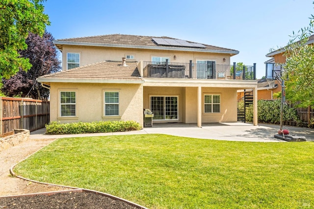 1238 Darling St, Napa, CA 94558 - rear view of house with stairs, a patio, stucco siding, roof mounted solar panels, and a fenced backyard