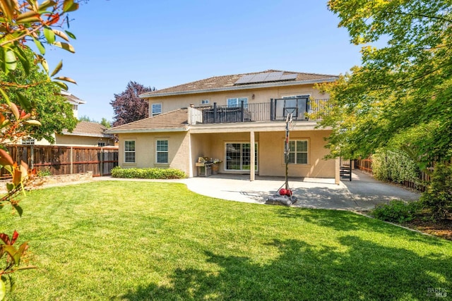 1238 Darling St, Napa, CA 94558 - back of house with stucco siding, a patio area, roof mounted solar panels, a fenced backyard, and a balcony