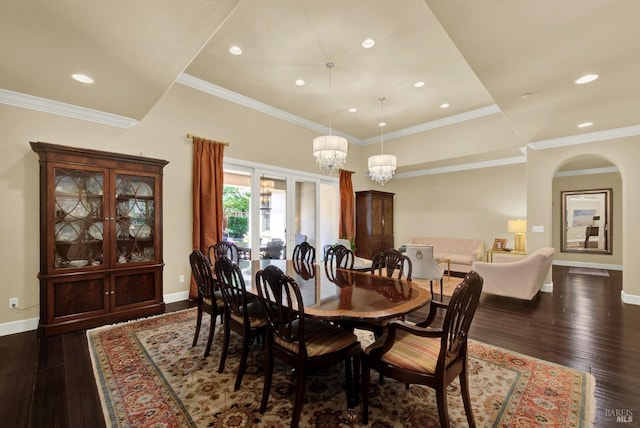 2986 Pebble Beach Cir, Fairfield, CA 94534 - dining room featuring baseboards, dark wood-style floors, a chandelier, ornamental molding, and arched walkways