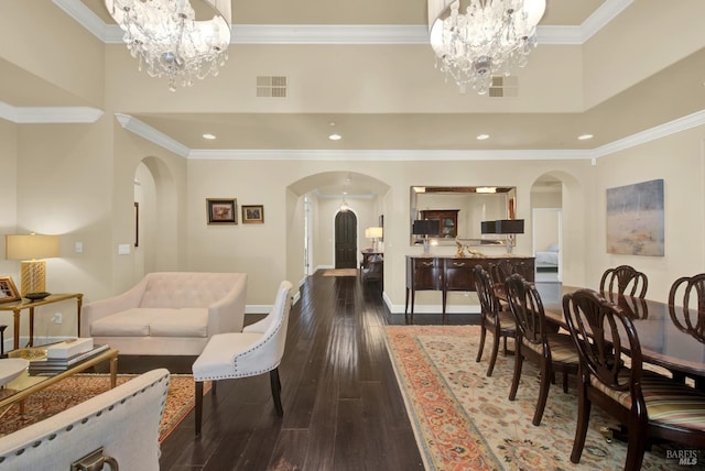 2986 Pebble Beach Cir, Fairfield, CA 94534 - dining space featuring arched walkways, a chandelier, recessed lighting, dark wood-type flooring, and ornamental molding