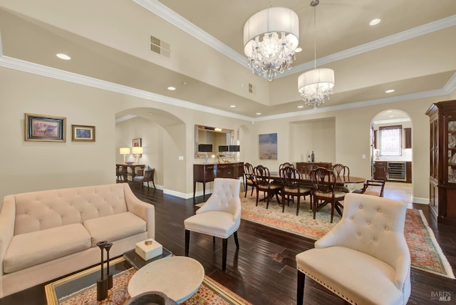 2986 Pebble Beach Cir, Fairfield, CA 94534 - living room featuring arched walkways, dark wood-type flooring, a chandelier, baseboards, and ornamental molding