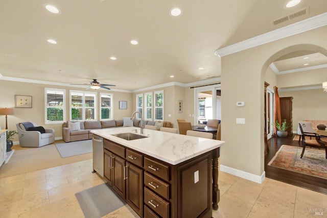 2986 Pebble Beach Cir, Fairfield, CA 94534 - kitchen with a sink, arched walkways, stainless steel dishwasher, open floor plan, and recessed lighting