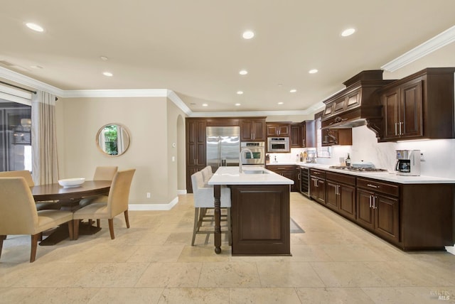 2986 Pebble Beach Cir, Fairfield, CA 94534 - kitchen featuring appliances with stainless steel finishes, light countertops, crown molding, baseboards, and a breakfast bar area