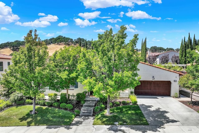 2986 Pebble Beach Cir, Fairfield, CA 94534 - view of front of property with an attached garage, concrete driveway, stucco siding, and a front lawn
