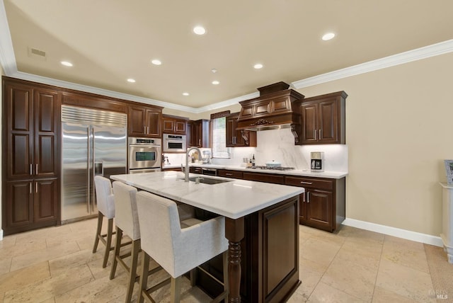 2986 Pebble Beach Cir, Fairfield, CA 94534 - kitchen featuring stainless steel appliances, a sink, custom exhaust hood, ornamental molding, and light countertops