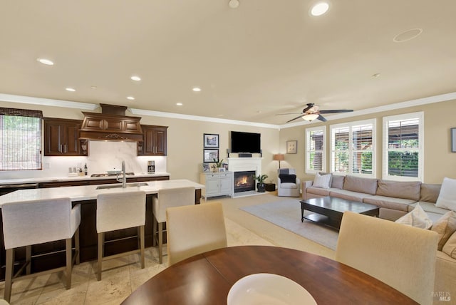 2986 Pebble Beach Cir, Fairfield, CA 94534 - living room with crown molding, recessed lighting, a lit fireplace, and a ceiling fan