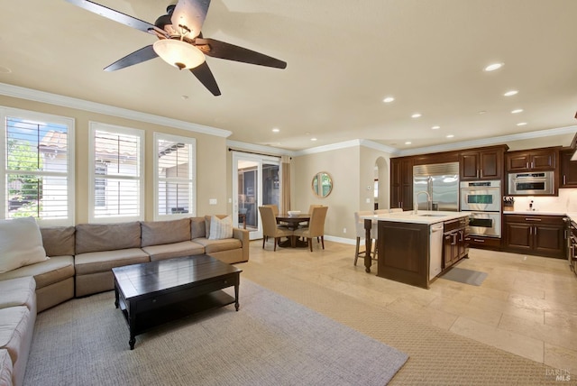 2986 Pebble Beach Cir, Fairfield, CA 94534 - living room with recessed lighting, crown molding, ceiling fan, arched walkways, and baseboards