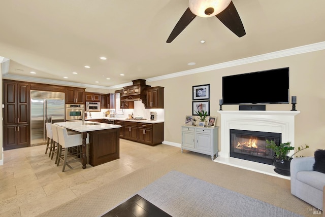 2986 Pebble Beach Cir, Fairfield, CA 94534 - kitchen featuring stainless steel appliances, a sink, open floor plan, a breakfast bar area, and light countertops