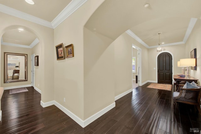 2986 Pebble Beach Cir, Fairfield, CA 94534 - entryway with arched walkways, dark wood-type flooring, baseboards, ornamental molding, and a chandelier