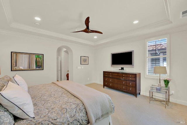 2986 Pebble Beach Cir, Fairfield, CA 94534 - bedroom featuring a tray ceiling, crown molding, baseboards, light carpet, and arched walkways