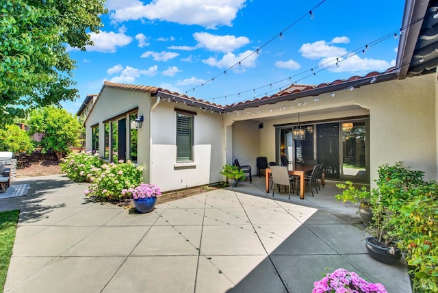 2986 Pebble Beach Cir, Fairfield, CA 94534 - back of property with a patio area, a tiled roof, stucco siding, and outdoor dining area