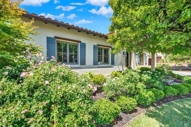 2986 Pebble Beach Cir, Fairfield, CA 94534 - back of house with stucco siding and a tile roof