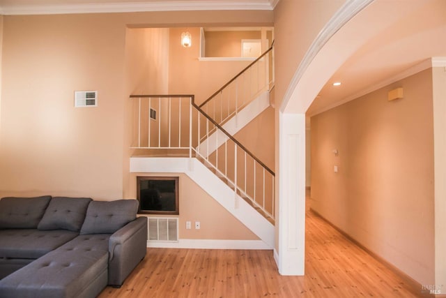 1205 Rosebriar Way, San Jose, CA 95131 - unfurnished living room featuring wood finished floors, crown molding, stairway, and recessed lighting