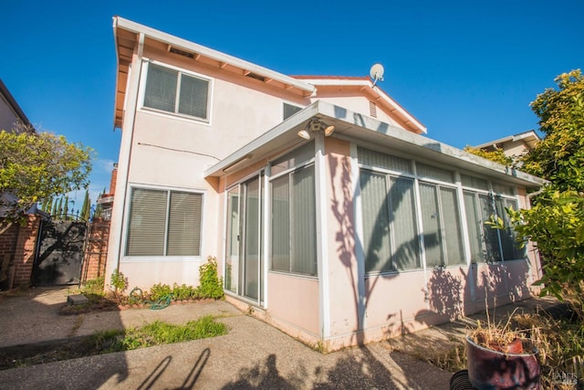 1205 Rosebriar Way, San Jose, CA 95131 - rear view of property featuring a sunroom and stucco siding