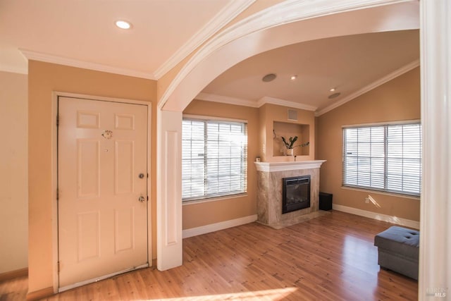 1205 Rosebriar Way, San Jose, CA 95131 - entryway with a fireplace, arched walkways, wood finished floors, crown molding, and recessed lighting