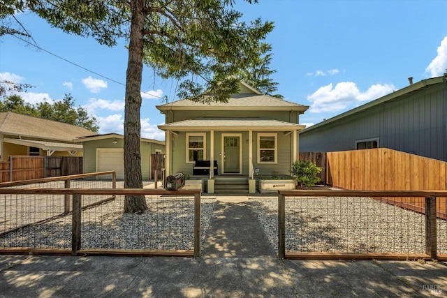 211 Mulberry St, Cloverdale, CA 95425 - shotgun-style home featuring a fenced front yard, a shingled roof, covered porch, and a gate