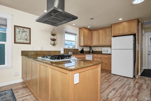 211 Mulberry St, Cloverdale, CA 95425 - kitchen with white appliances, island range hood, a peninsula, a sink, and dark stone counters
