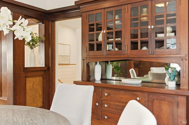 1572 Vista St, Oakland, CA 94602 - kitchen featuring brown cabinetry and glass insert cabinets