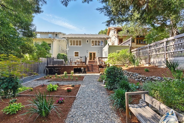1572 Vista St, Oakland, CA 94602 - back of property with a garden, a deck, and stucco siding