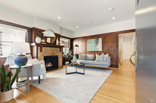 1572 Vista St, Oakland, CA 94602 - living room featuring a tile fireplace, light wood finished floors, and recessed lighting
