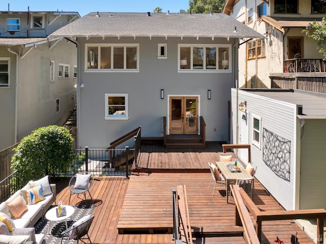 1572 Vista St, Oakland, CA 94602 - rear view of house featuring stucco siding, a deck, outdoor dining space, french doors, and a shingled roof