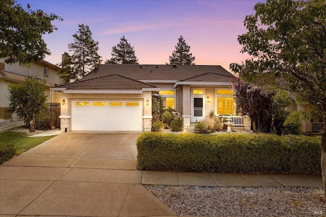 2832 Parkview Ter, Fairfield, CA 94534 - view of front facade with an attached garage, stucco siding, a tile roof, and concrete driveway