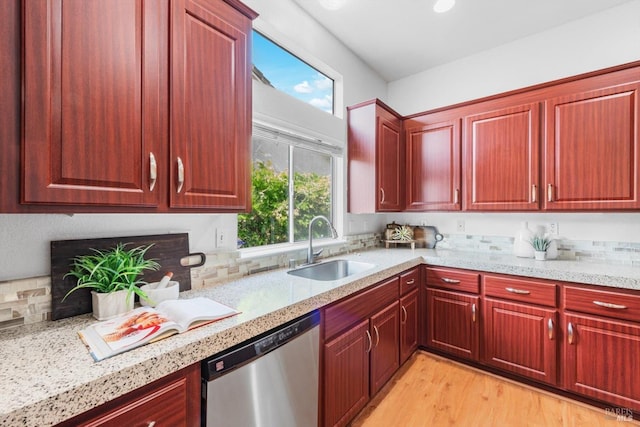 2832 Parkview Ter, Fairfield, CA 94534 - kitchen featuring stainless steel dishwasher, a sink, light wood-type flooring, and reddish brown cabinets