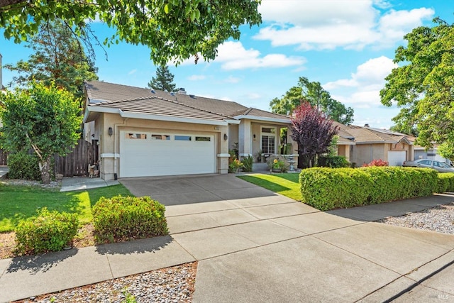 2832 Parkview Ter, Fairfield, CA 94534 - view of front of home featuring an attached garage, concrete driveway, stucco siding, and a tile roof