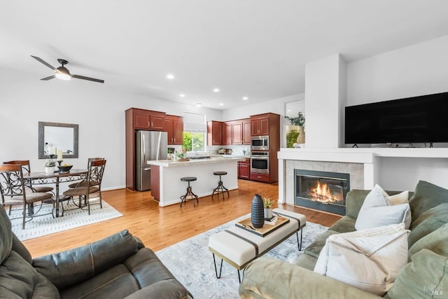 2832 Parkview Ter, Fairfield, CA 94534 - living area featuring a ceiling fan, light wood-style flooring, recessed lighting, and a tiled fireplace