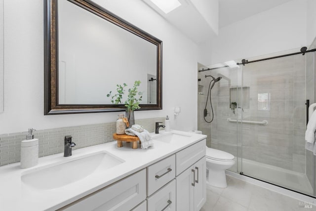 2832 Parkview Ter, Fairfield, CA 94534 - full bath with double vanity, a stall shower, toilet, backsplash, and marble look tile flooring