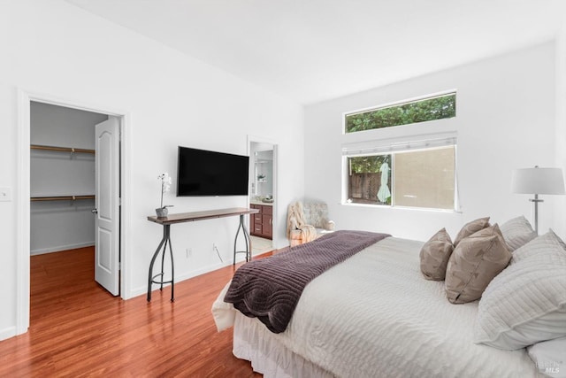 2832 Parkview Ter, Fairfield, CA 94534 - bedroom featuring light wood finished floors, a walk in closet, a closet, and baseboards