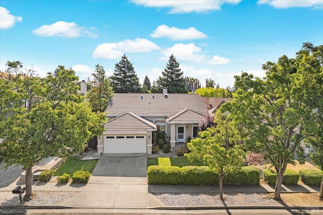 2832 Parkview Ter, Fairfield, CA 94534 - view of front of property featuring a tiled roof, an attached garage, concrete driveway, and stucco siding