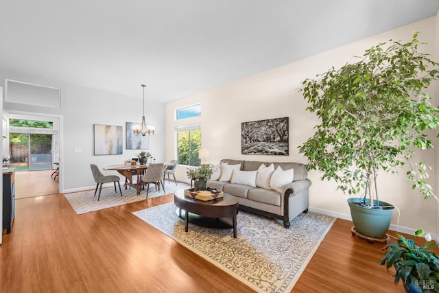 2832 Parkview Ter, Fairfield, CA 94534 - living room featuring wood finished floors, a chandelier, and baseboards