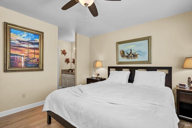13201 Keys Blvd, Clearlake Oaks, CA 95423 - bedroom featuring light wood finished floors, baseboards, ensuite bathroom, and a ceiling fan