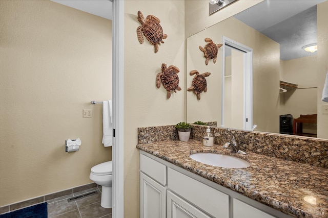 13201 Keys Blvd, Clearlake Oaks, CA 95423 - bathroom featuring vanity, tile patterned flooring, toilet, and baseboards